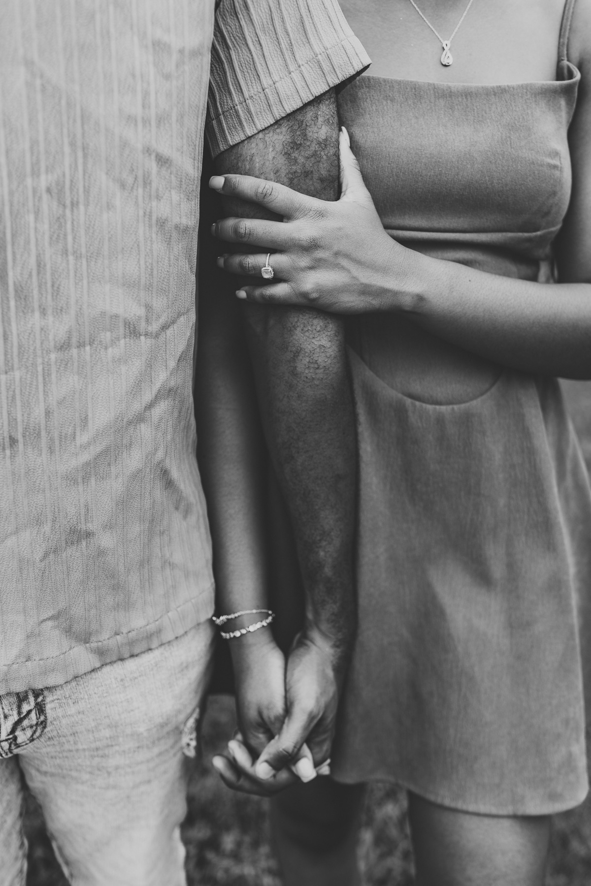 Danieca's engagement ring as she holds Cael's arm